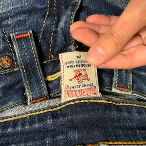 Orange trim true religion jeans